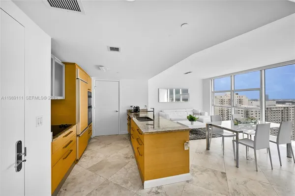 a living room with furniture stove and a flat screen tv