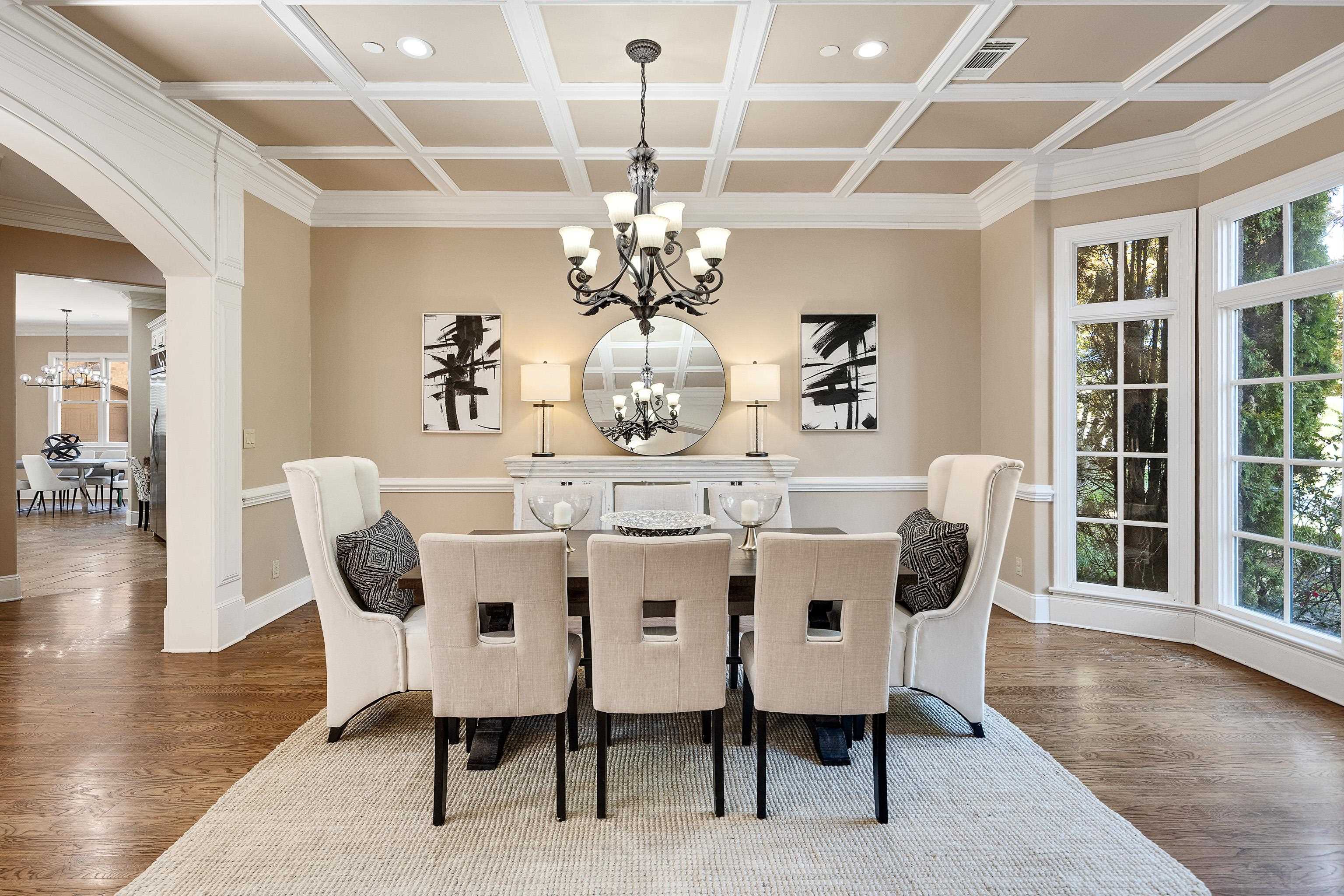 425 Buckland Cove Eads, TN 38028 - Photo 6 of 29 Dining space featuring a chandelier, arched walkways, dark wood-style flooring, coffered ceiling, and recessed lighting