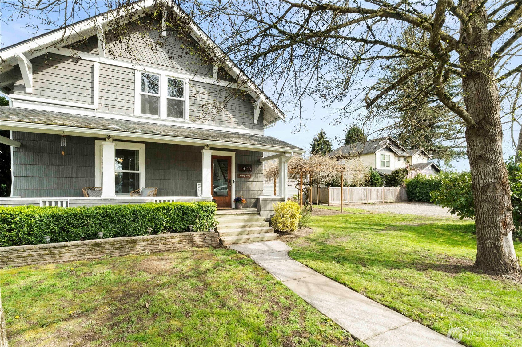 425 Valley Avenue East Sumner, WA 98390 - Photo 2 of 34 a front view of house with yard and swimming pool