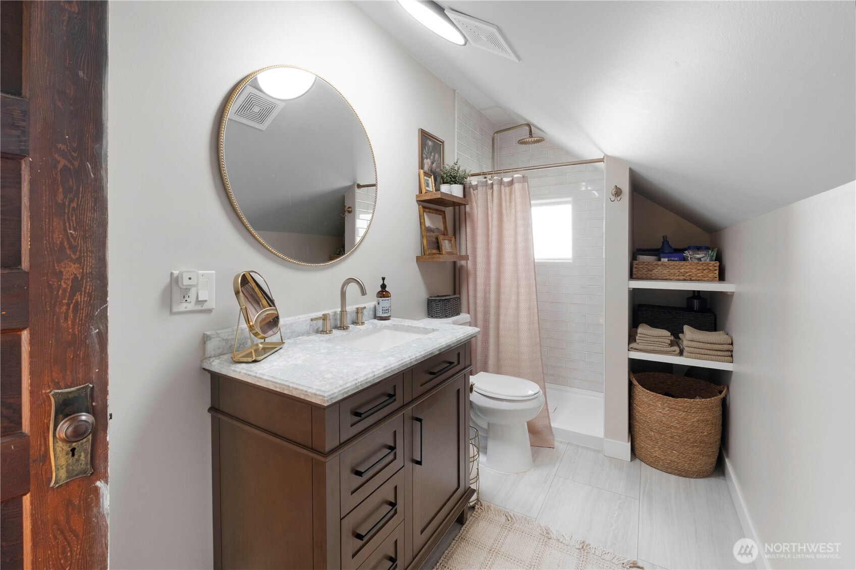 425 Valley Avenue East Sumner, WA 98390 - Photo 22 of 34 a bathroom with a toilet sink and mirror