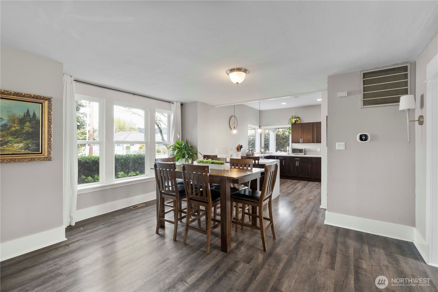 425 Valley Avenue East Sumner, WA 98390 - Photo 10 of 34 a view of a dining room with furniture and wooden floor