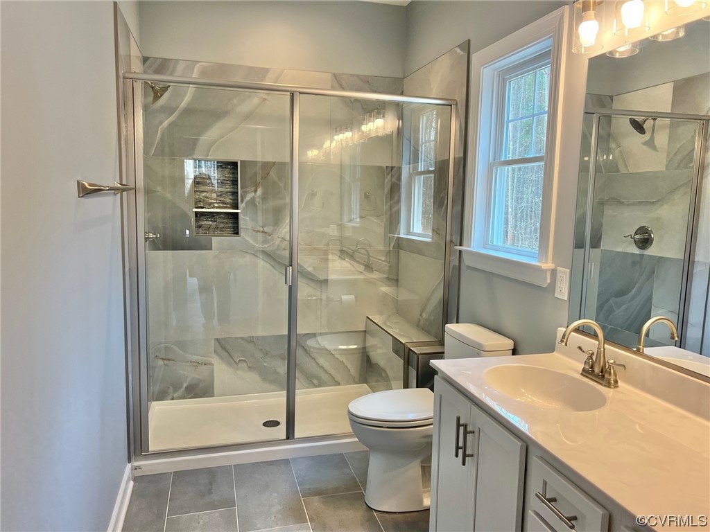 1072 Eastham Road Bumpass, VA 23024 - Photo 14 of 26 a bathroom with a shower a toilet and a sink