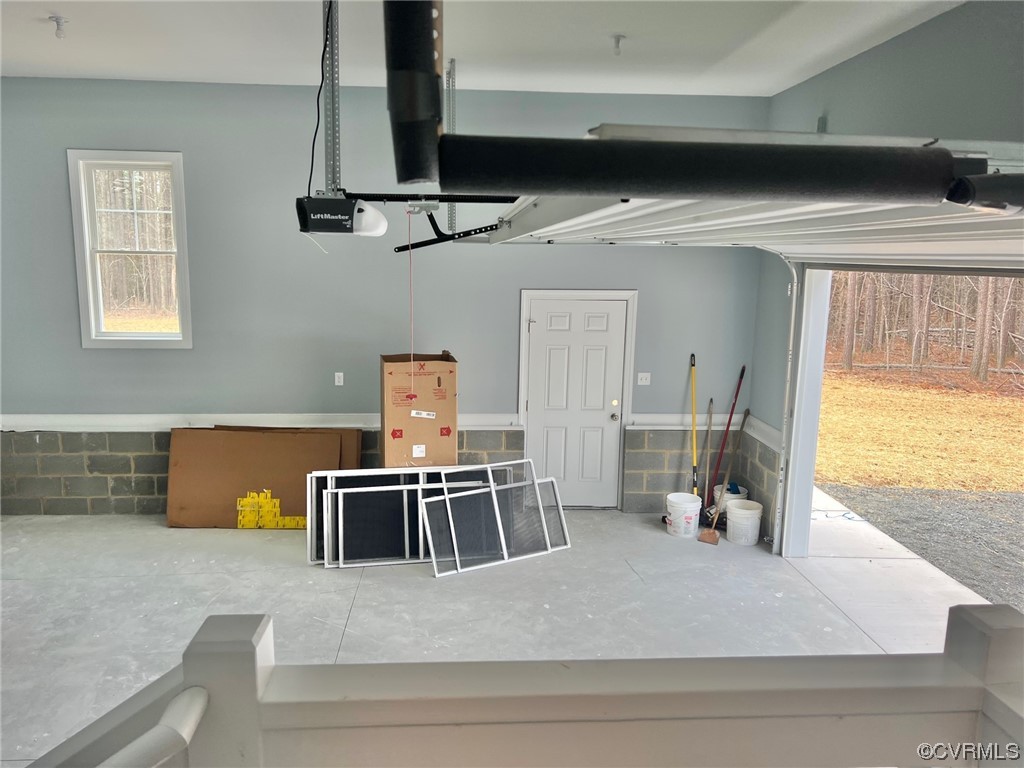 1072 Eastham Road Bumpass, VA 23024 - Photo 21 of 26 a kitchen with a stove a refrigerator and a dining table