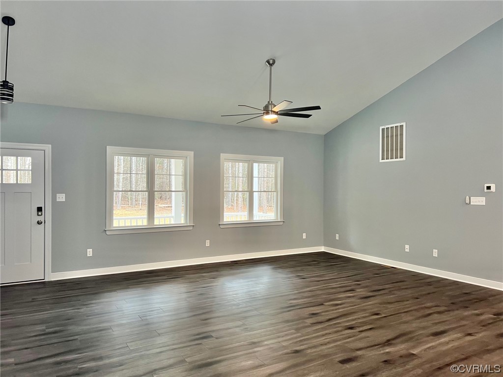 1072 Eastham Road Bumpass, VA 23024 - Photo 10 of 26 a view of an empty room with wooden floor and a window