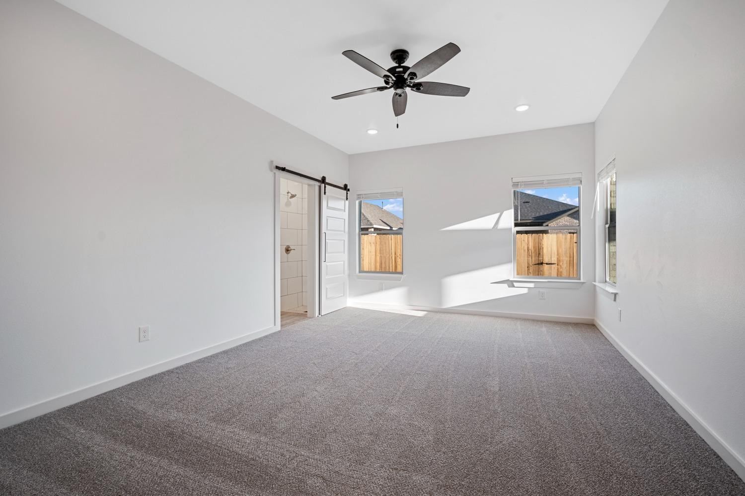 5902 Grinnell Street Lubbock, TX 79416 - Photo 13 of 26 a view of a livingroom with a ceiling fan and window