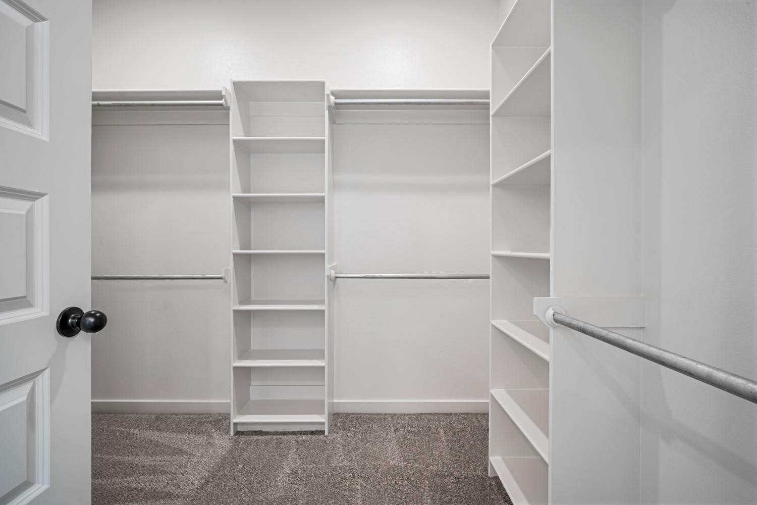 5902 Grinnell Street Lubbock, TX 79416 - Photo 18 of 26 a view of walk in closet with empty racks