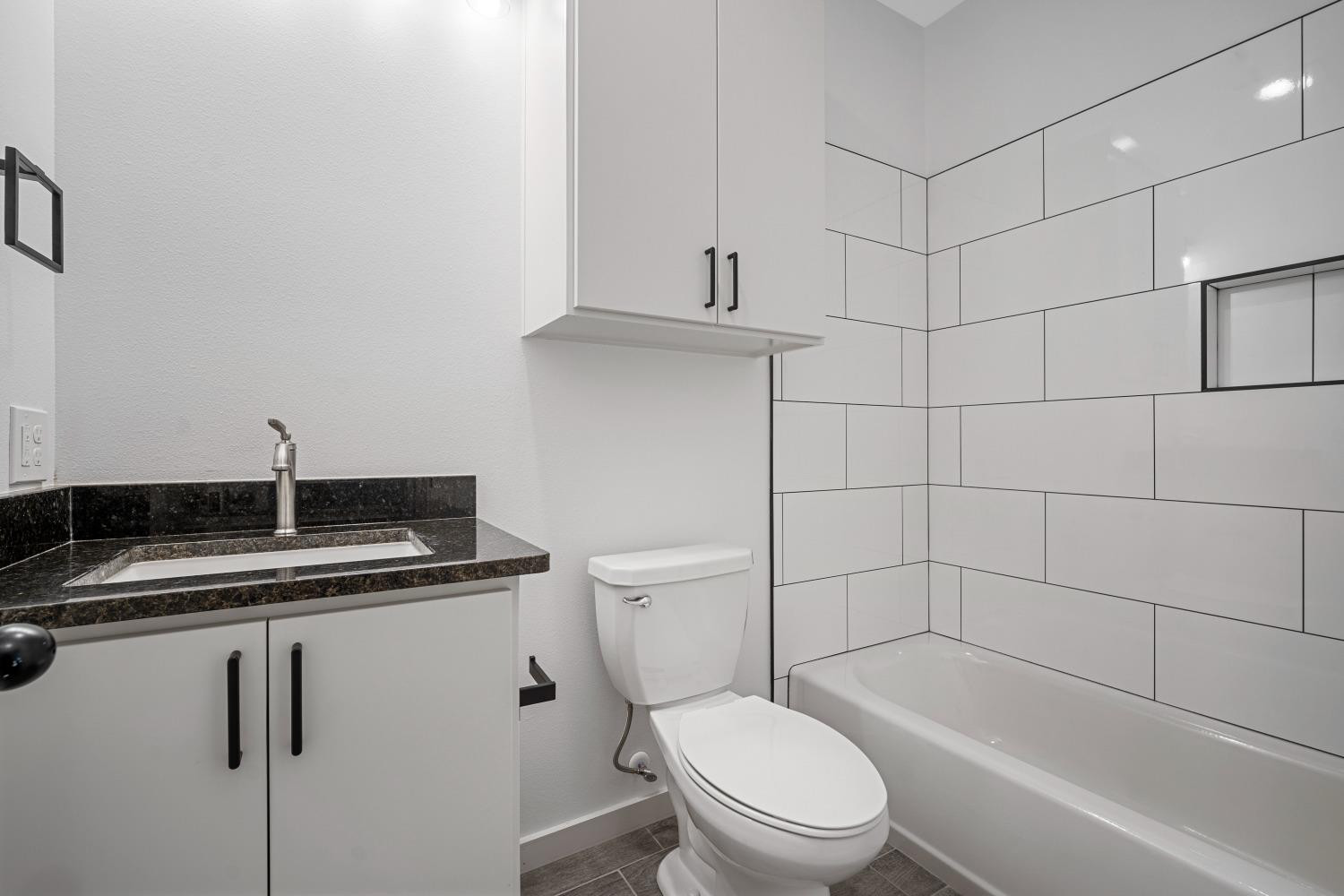 5902 Grinnell Street Lubbock, TX 79416 - Photo 20 of 26 a bathroom with a sink a toilet and shower