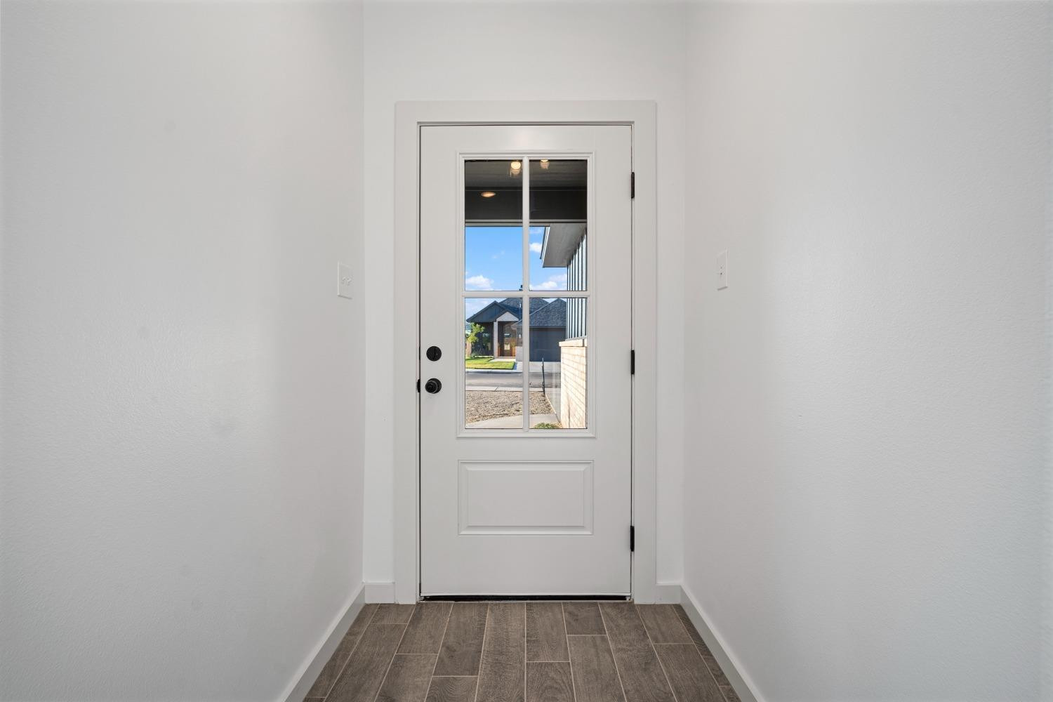 5902 Grinnell Street Lubbock, TX 79416 - Photo 4 of 26 a view of walk in closet with wooden floor