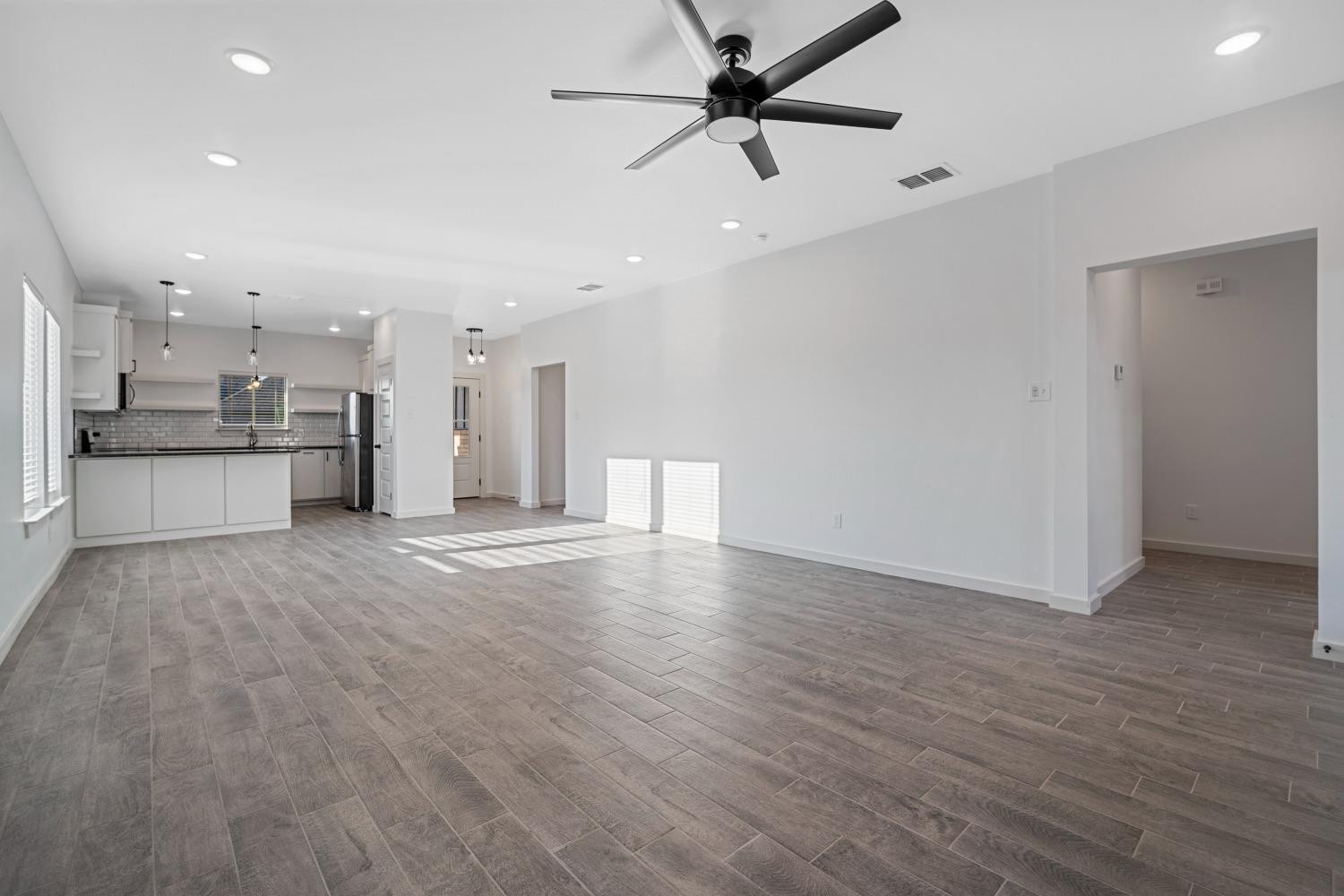 5902 Grinnell Street Lubbock, TX 79416 - Photo 7 of 26 a view of a kitchen with a sink and a stove top oven