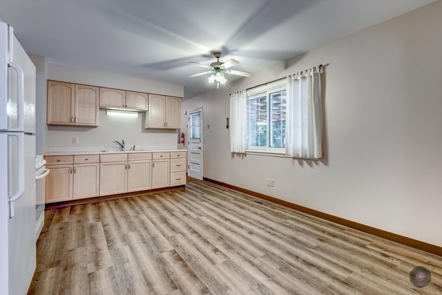 55 Sheffield Road Montgomery, IL 60538 - Photo 14 of 28 a view of a kitchen with microwave and cabinets