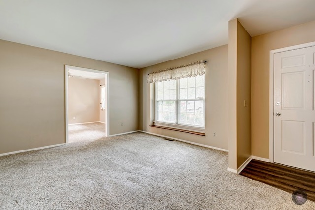 55 Sheffield Road Montgomery, IL 60538 - Photo 3 of 28 an empty room with windows