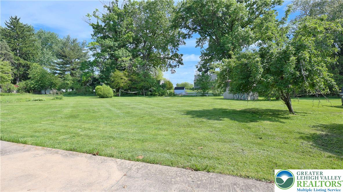 1345 Macada Road Bethlehem, PA 18017 - Photo 22 of 23 a view of a grassy field with trees