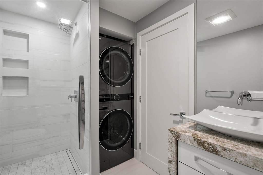 65 Lake Avenue, Unit 1003 Worcester, MA 01604 - Photo 22 of 38 a bathroom with a sink and a washer dryer
