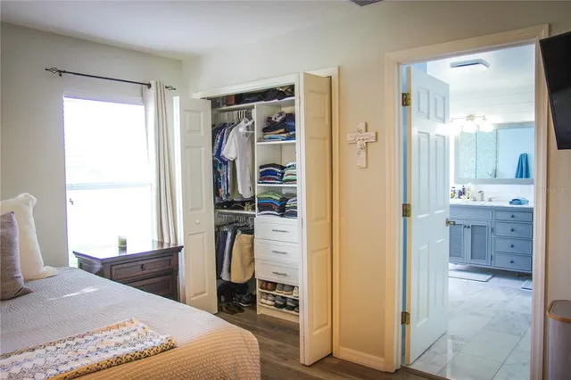 a bedroom with a bed and a view of bathroom