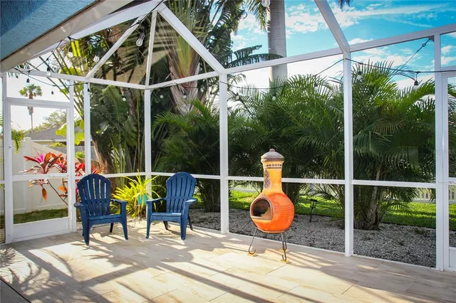 a view of an chairs and table in the patio
