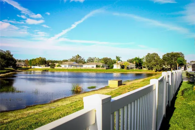 a view of swimming pool with outdoor seating and yard
