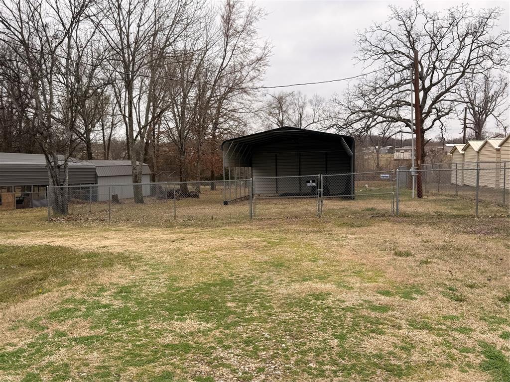 382 Broken Bow Quitman, TX 75783 - Photo 4 of 12 a backyard of a house with table and chairs
