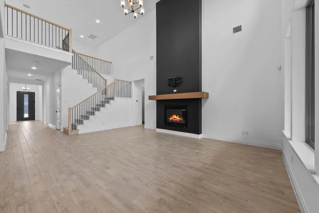 a view of a kitchen with a sink and a fireplace