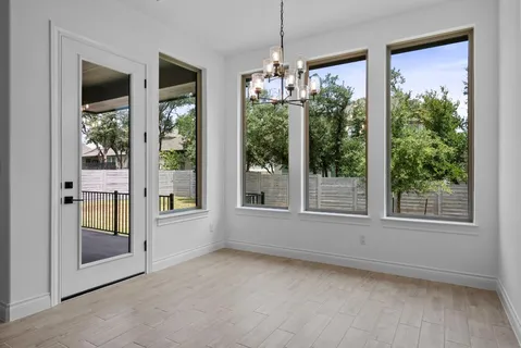 a kitchen with granite countertop a stove and a refrigerator