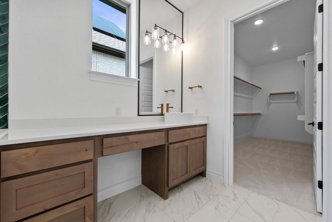 109 Strawberry Lane Georgetown, TX 78628 - Photo 23 of 40 a bathroom with a sink and a mirror