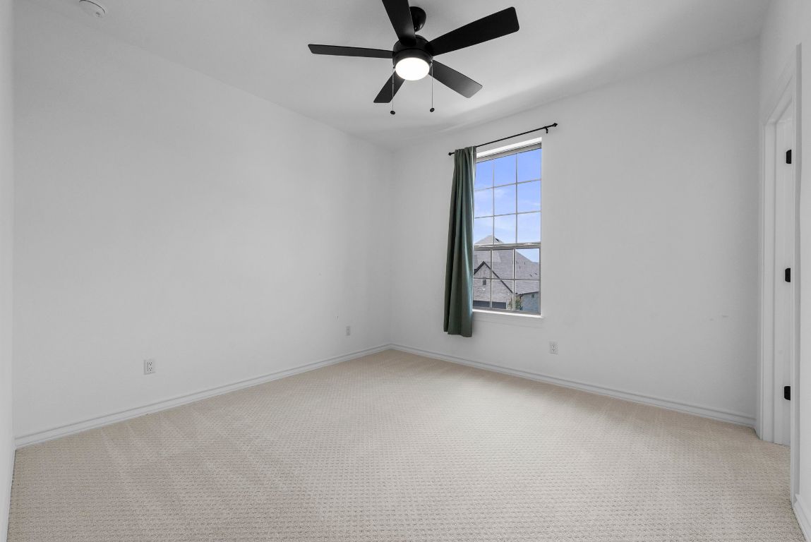 109 Strawberry Lane Georgetown, TX 78628 - Photo 34 of 40 an empty room with windows and fan