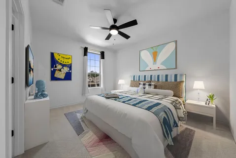 a bedroom with a bed and a chandelier