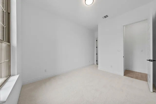 a bathroom with a granite countertop sink a toilet and a mirror