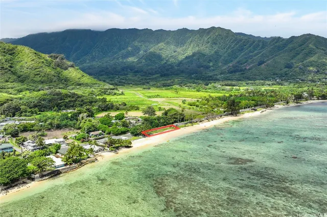 a view of a lush green hillside and houses
