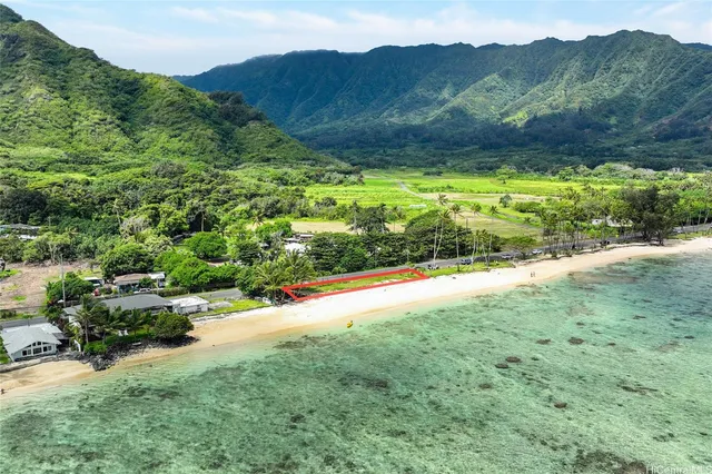 a view of a lush green hillside and houses