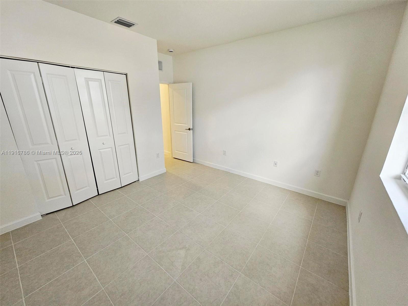 16233 Southwest 147th Place, Unit STUDIO Miami, FL 33193 - Photo 6 of 7 a view of an empty room