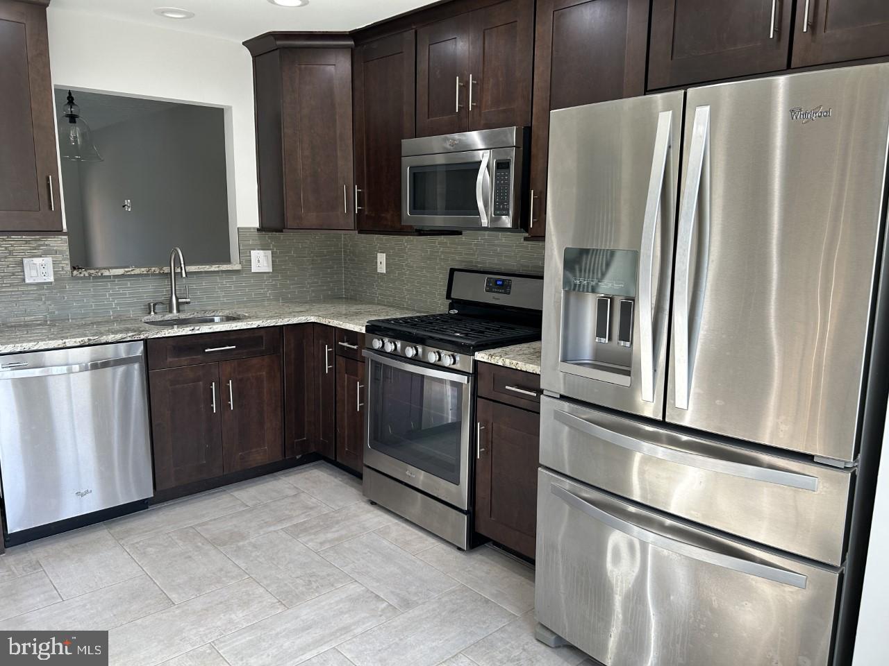 209 Quiet Ridge Court Pasadena, MD 21122 - Photo 6 of 32 Pass thru to dining area