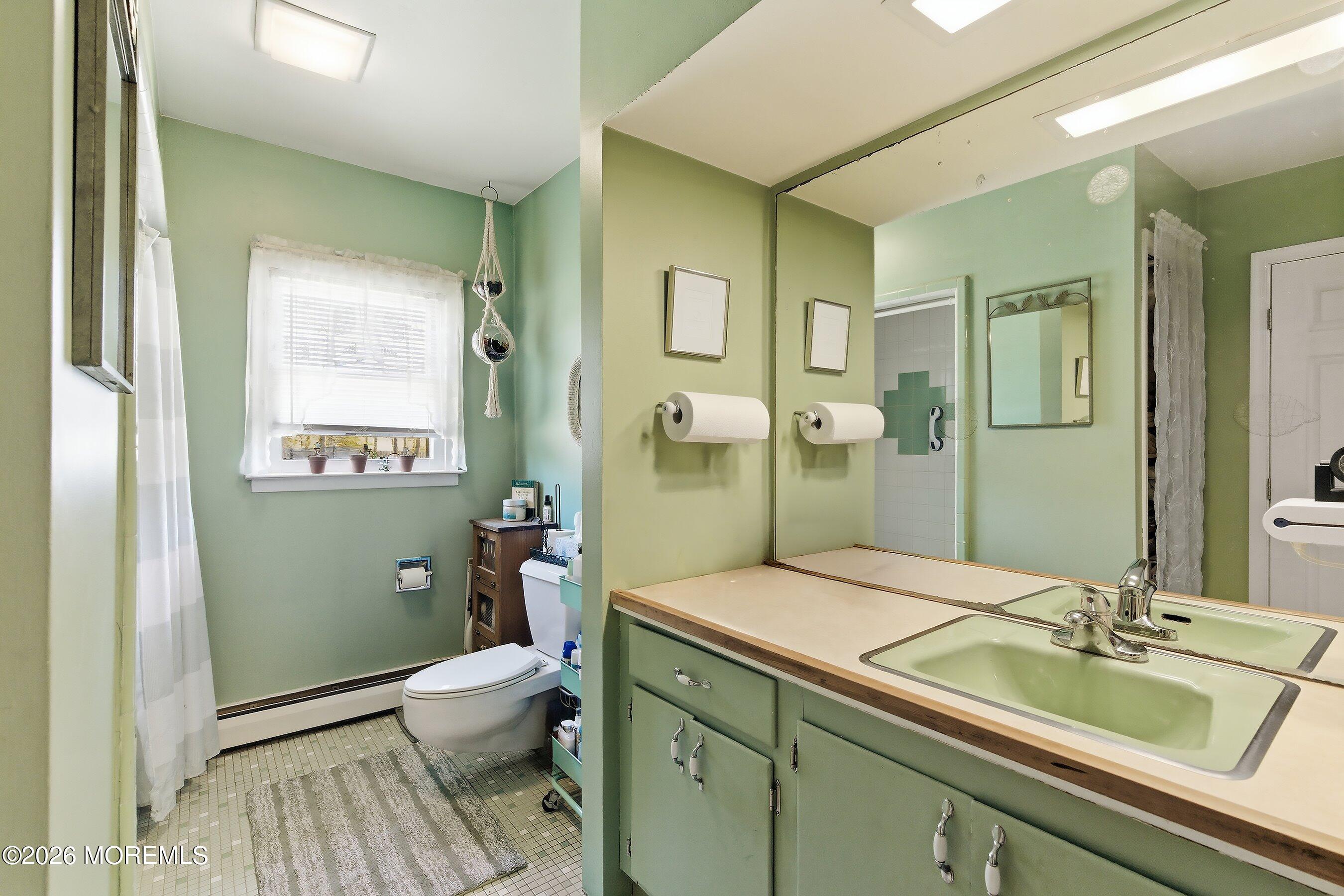 745 Oak Glen Road Howell, NJ 07731 - Photo 21 of 46 a bathroom with a granite countertop sink toilet and shower