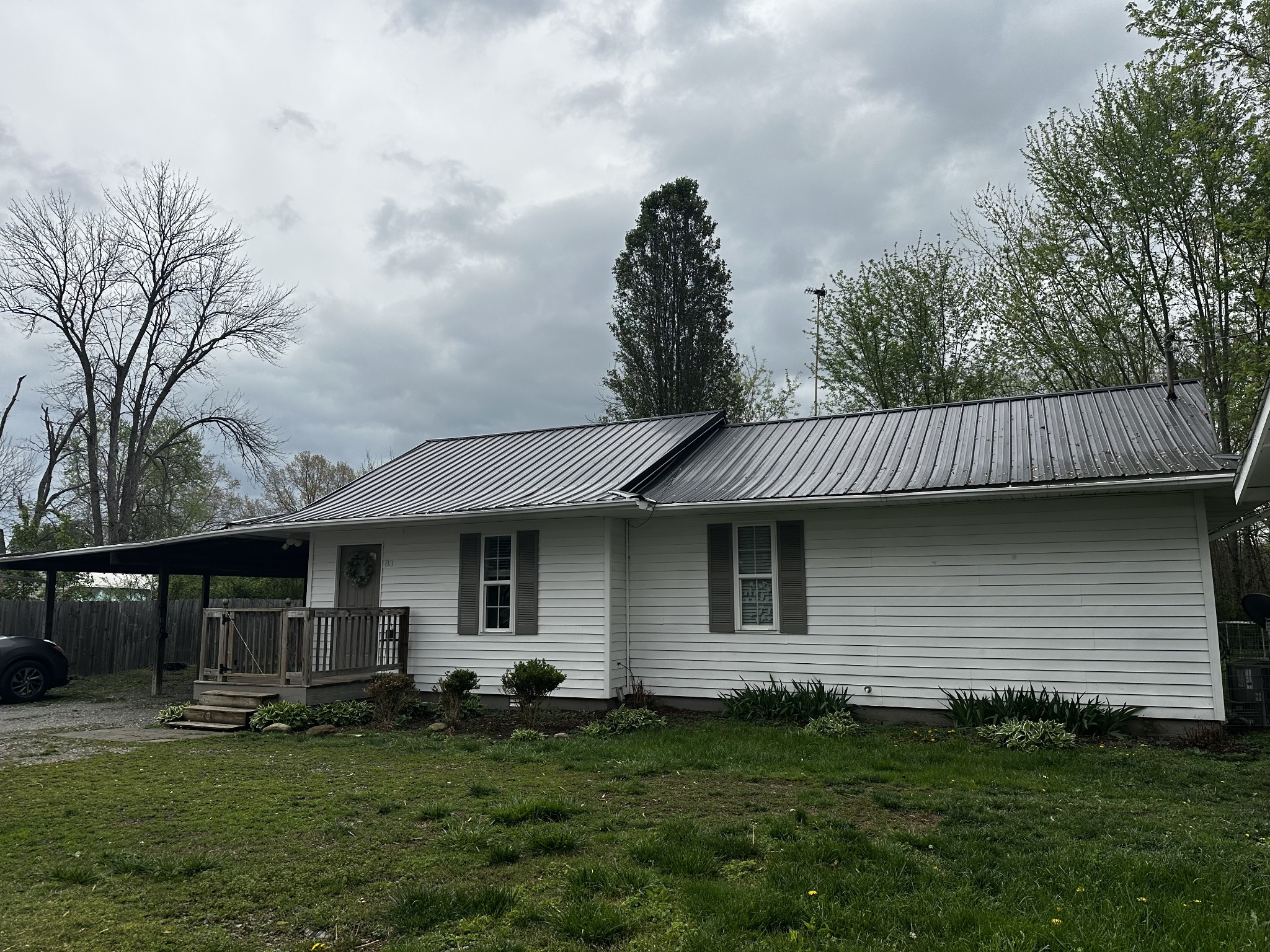83 Hideout Road Manchester, TN 37355 - Photo 2 of 22 a front view of a house with a garden