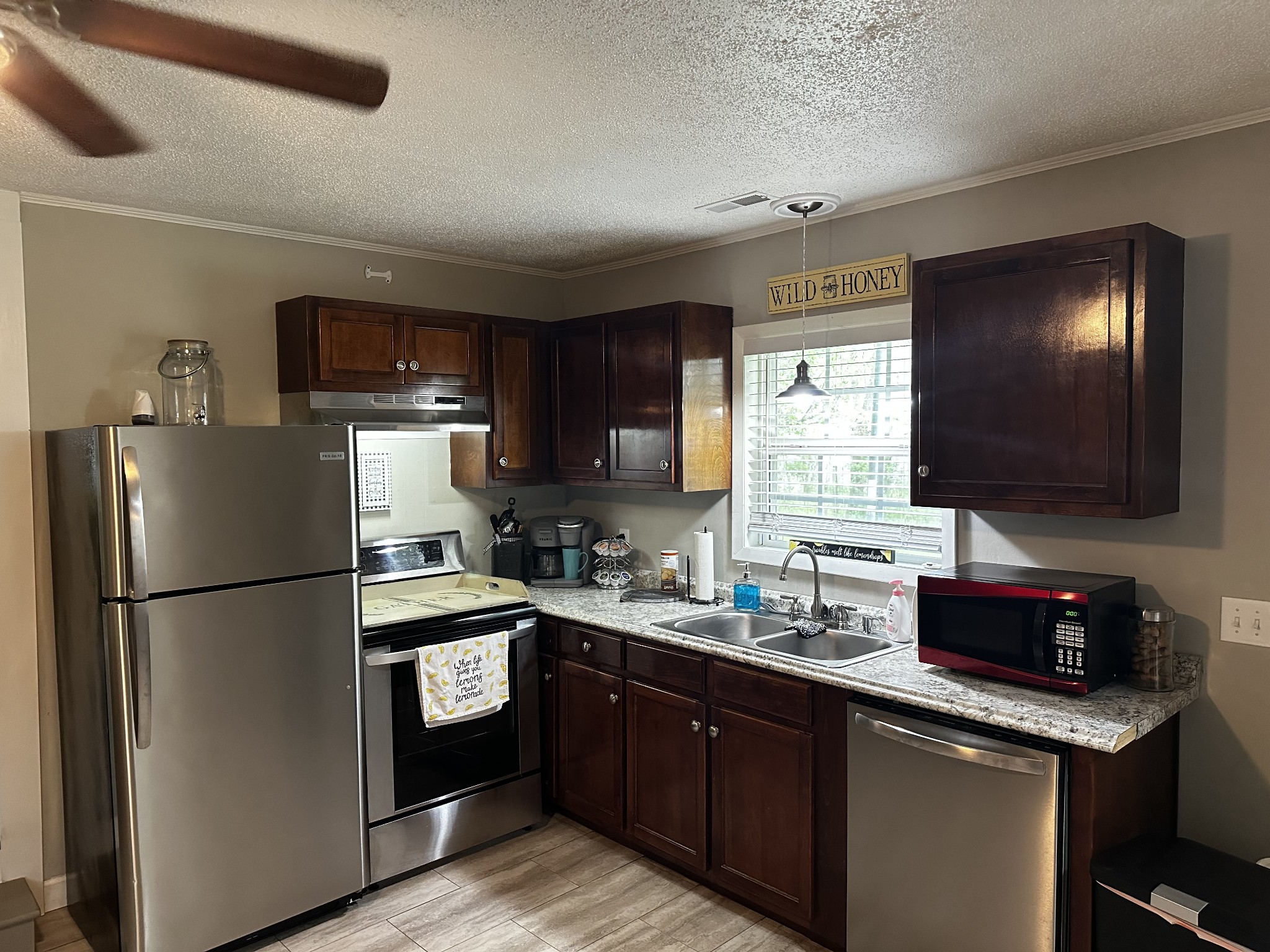 83 Hideout Road Manchester, TN 37355 - Photo 8 of 22 a kitchen with a refrigerator stove and sink