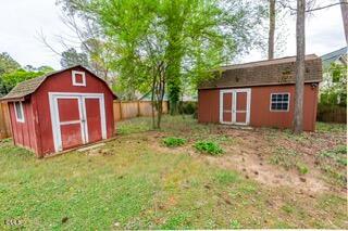408 Ortega Road Raleigh, NC 27609 - Photo 21 of 25 a front view of a house with garden