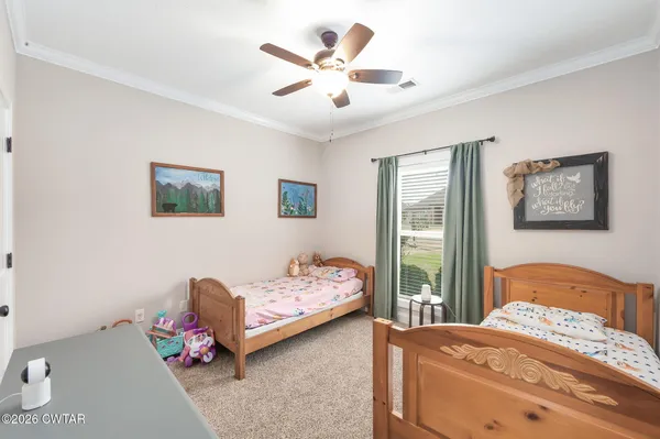 a bedroom with bed and window