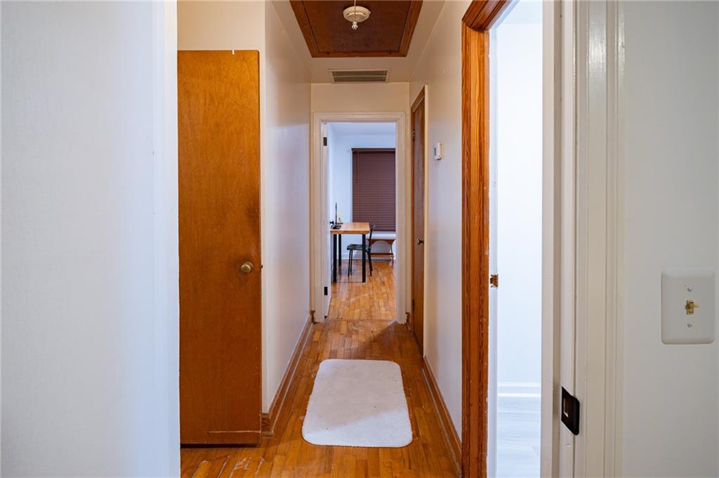 67 Dixie Park Drive Northwest Rome, GA 30165 - Photo 13 of 27 a view of a hallway with wooden floor and a living room