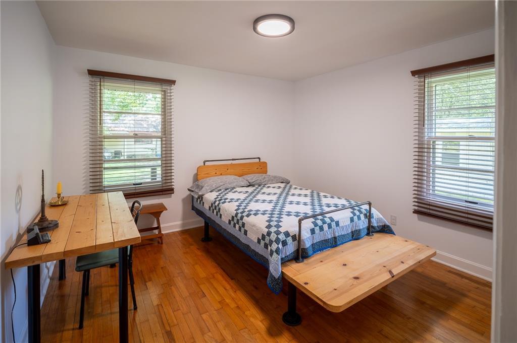 67 Dixie Park Drive Northwest Rome, GA 30165 - Photo 15 of 27 a bedroom with a bed and wooden floor
