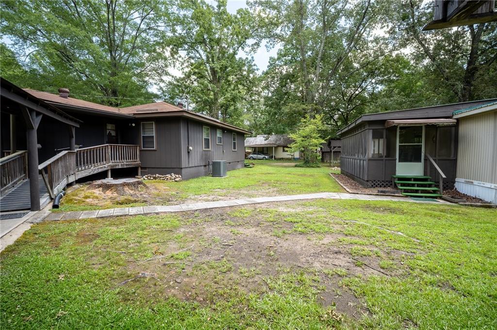 67 Dixie Park Drive Northwest Rome, GA 30165 - Photo 18 of 27 a view of a backyard with a large tree