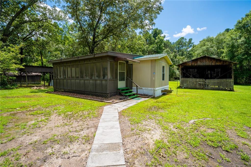 67 Dixie Park Drive Northwest Rome, GA 30165 - Photo 19 of 27 a view of a backyard with a small cabin