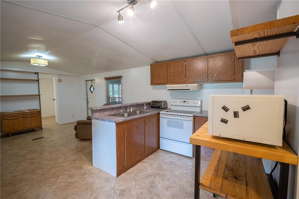 67 Dixie Park Drive Northwest Rome, GA 30165 - Photo 21 of 27 a kitchen with a stove and a refrigerator