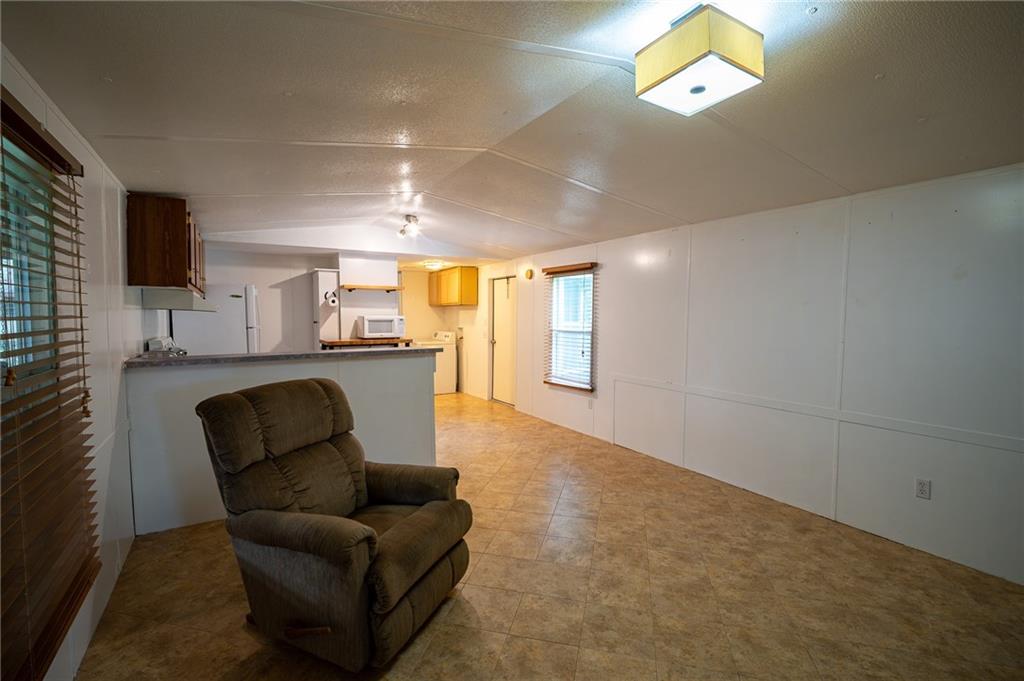67 Dixie Park Drive Northwest Rome, GA 30165 - Photo 22 of 27 a living room with furniture and a flat screen tv