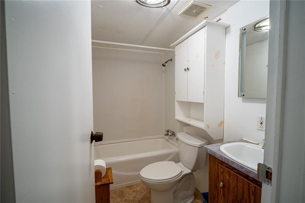 67 Dixie Park Drive Northwest Rome, GA 30165 - Photo 24 of 27 a bathroom with a sink a toilet and shower