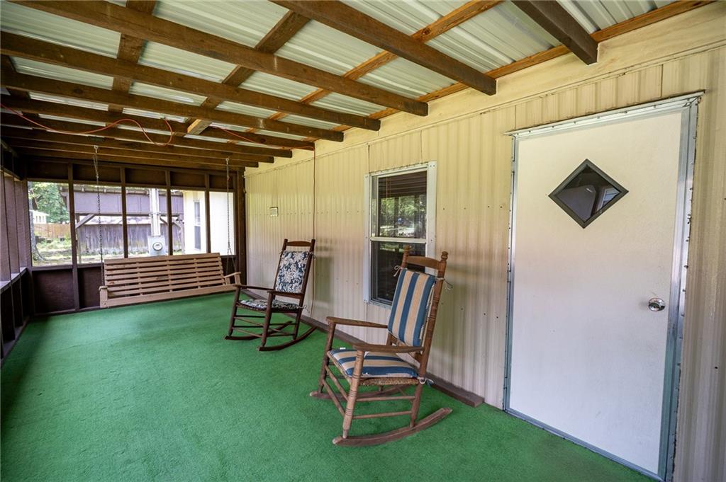67 Dixie Park Drive Northwest Rome, GA 30165 - Photo 26 of 27 a view of a backyard with chairs and a garden