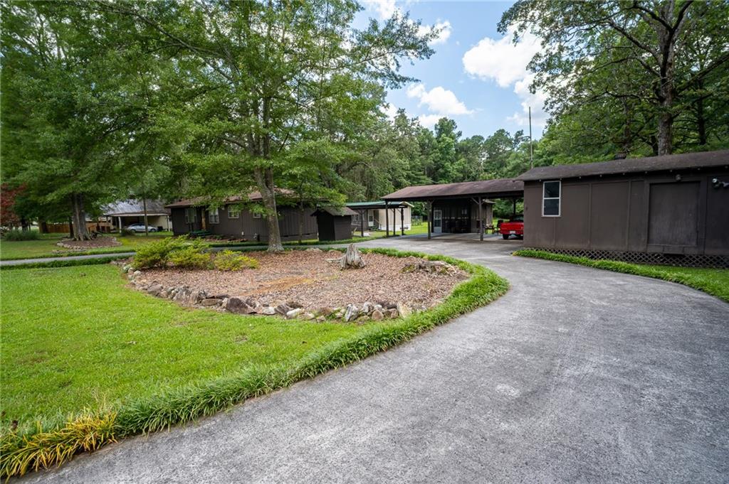 67 Dixie Park Drive Northwest Rome, GA 30165 - Photo 4 of 27 a view of a house with backyard and sitting area