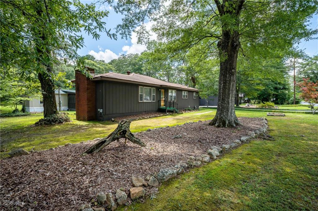 67 Dixie Park Drive Northwest Rome, GA 30165 - Photo 5 of 27 a view of a house with backyard and a tree