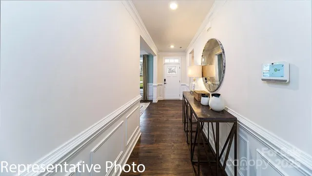 a view of a hallway with front door