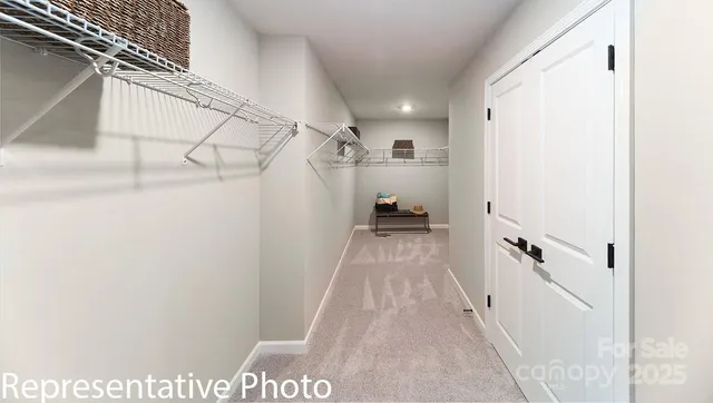 a view of a hallway with stairs