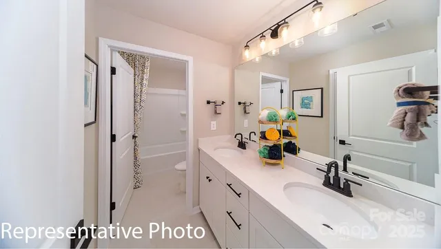 a bathroom with a sink and mirror