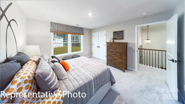 a bedroom with a bed and furniture